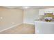 Bright kitchen with white appliances, light granite countertop and white cabinets offering ample storage space at 5259 Images Cir # 301, Kissimmee, FL 34746