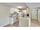 Cozy kitchen with white appliances, granite countertop and white cabinets offering ample storage space at 5259 Images Cir # 301, Kissimmee, FL 34746