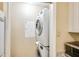 Convenient laundry closet with stacked washer and dryer units maximizing space efficiency at 5259 Images Cir # 301, Kissimmee, FL 34746