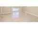 Living room featuring bright tile flooring, neutral paint and sliding glass doors that brings in plenty of natural light at 5259 Images Cir # 301, Kissimmee, FL 34746