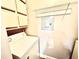 Laundry room with washing machine, dryer, white cabinets, and wire shelving at 5500 Devonbriar Way # 202, Orlando, FL 32822