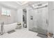 Luxurious bathroom featuring a soaking tub, a glass enclosed shower, and modern fixtures at 621 Estates Pl, Longwood, FL 32779
