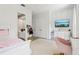 Bedroom view with cozy bed, TV, and ensuite bath at 621 Estates Pl, Longwood, FL 32779