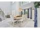 Elegant dining room with a chandelier and large windows at 621 Estates Pl, Longwood, FL 32779