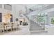 Open-concept dining area leading to the kitchen and living spaces at 621 Estates Pl, Longwood, FL 32779