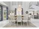 Cozy dining area features an elegant chandelier, large windows, and stylish décor at 621 Estates Pl, Longwood, FL 32779