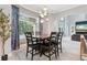 Dining area with a view of the backyard pool at 621 Estates Pl, Longwood, FL 32779