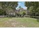 Stately home featuring mature landscaping and a lush, green lawn at 621 Estates Pl, Longwood, FL 32779