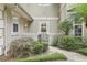 View of the front entrance and landscaped area of the house at 621 Estates Pl, Longwood, FL 32779