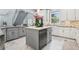 Bright kitchen featuring gray cabinetry, a center island, and white marble floors at 621 Estates Pl, Longwood, FL 32779