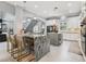 Spacious kitchen with marble countertops, stylish bar stools, and an elegant staircase nearby at 621 Estates Pl, Longwood, FL 32779