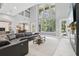 Bright living room featuring high ceilings and ample natural light at 621 Estates Pl, Longwood, FL 32779