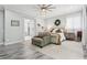 Spacious main bedroom with sitting area, ceiling fan, and ensuite bath at 621 Estates Pl, Longwood, FL 32779