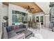 Cozy outdoor living space with a wood ceiling, comfortable seating, and a view of the pool area at 621 Estates Pl, Longwood, FL 32779
