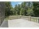 Patio with white decorative railing overlooking the lush green yard at 621 Estates Pl, Longwood, FL 32779