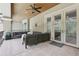 View of the covered patio with a ceiling fan, an outdoor seating area and doors to inside at 621 Estates Pl, Longwood, FL 32779