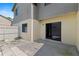 Exterior view of home with backyard patio and sliding glass door at 628 Olympic Dr # 8-C, Ocoee, FL 34761