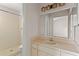 Bathroom with a step-in shower, large mirror, and a vanity sink at 628 Olympic Dr # 8-C, Ocoee, FL 34761