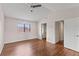 Bedroom with vaulted ceiling, ceiling fan, and large window at 628 Olympic Dr # 8-C, Ocoee, FL 34761