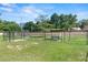 Community dog park featuring fenced areas, benches, and lush green grass at 628 Olympic Dr # 8-C, Ocoee, FL 34761