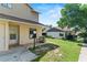 Charming home featuring a well-kept lawn, an exterior light and neutral paint tones at 628 Olympic Dr # 8-C, Ocoee, FL 34761
