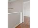 Bright hallway featuring hardwood floors and a modern ceiling fan at 628 Olympic Dr # 8-C, Ocoee, FL 34761