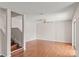 Bright living space with hardwood-style floors, fan and stairs to upper level at 628 Olympic Dr # 8-C, Ocoee, FL 34761