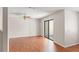 Inviting living area featuring hardwood floors, natural light, and a sliding glass door at 628 Olympic Dr # 8-C, Ocoee, FL 34761