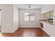 Living room with neutral paint, ceiling fan, and wood-look laminate floors at 628 Olympic Dr # 8-C, Ocoee, FL 34761