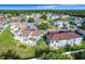 Community aerial showcasing the neighborhood's layout, landscaping, parking, ponds, and overall community charm at 709 Orchid Dr, Davenport, FL 33897