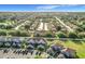 Extensive aerial view of the community with lush landscaping and rows of townhomes and ample parking at 709 Orchid Dr, Davenport, FL 33897