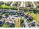 High angle aerial showing multiple townhomes with parking spaces and well-maintained landscaping in the community at 709 Orchid Dr, Davenport, FL 33897