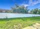 View of a grassy fenced-in backyard, offering privacy and space for outdoor activities and recreation at 709 Orchid Dr, Davenport, FL 33897