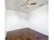 Comfortable bedroom with dark hardwood floors and ceiling fan offers a relaxing space at 709 Orchid Dr, Davenport, FL 33897