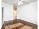 Bright bedroom featuring wood floors with an ensuite bathroom at 709 Orchid Dr, Davenport, FL 33897