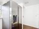 Modern kitchen featuring stainless steel appliances, white cabinetry, and granite countertops at 709 Orchid Dr, Davenport, FL 33897