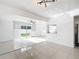 Open-concept living room with tiled floors and sliding glass doors bringing in ample natural light at 709 Orchid Dr, Davenport, FL 33897