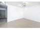 Empty living room with tiled flooring and modern lighting, ready for personalization and design at 709 Orchid Dr, Davenport, FL 33897
