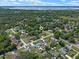 Expansive aerial view of the property showcasing its prime location near a serene lake at 73 Alano Rd, Debary, FL 32713