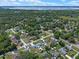 Beautiful aerial shot of a neighborhood featuring mature trees and well-maintained homes at 73 Alano Rd, Debary, FL 32713