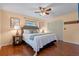 Comfortable bedroom with a ceiling fan, hardwood floors, and neutral color palette at 73 Alano Rd, Debary, FL 32713