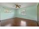 Well-lit bedroom with two windows and beautiful wood floors at 73 Alano Rd, Debary, FL 32713