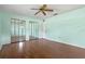 Spacious bedroom with wood floors and mirrored closet doors at 73 Alano Rd, Debary, FL 32713