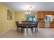 Dining room with a wooden table, seating for six, and a view of the backyard at 73 Alano Rd, Debary, FL 32713
