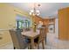 Dining area with backyard access and open layout to the kitchen and breakfast bar at 73 Alano Rd, Debary, FL 32713