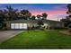 Charming single-story home with lush lawn, mature landscaping, and a two-car garage on a lovely lot at 73 Alano Rd, Debary, FL 32713