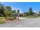 Well-maintained home featuring a manicured lawn, mature trees, and tasteful landscaping at 73 Alano Rd, Debary, FL 32713