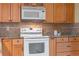 A view of the oven and microwave nestled among ample cabinet space in the kitchen at 73 Alano Rd, Debary, FL 32713