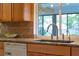 A close-up of the kitchen sink, granite counters and ample cabinetry at 73 Alano Rd, Debary, FL 32713
