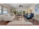 Inviting living room with hardwood floors, plush rug, and comfortable seating area with plenty of natural light at 73 Alano Rd, Debary, FL 32713